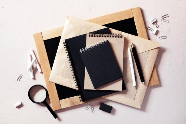 books and magnifying glass