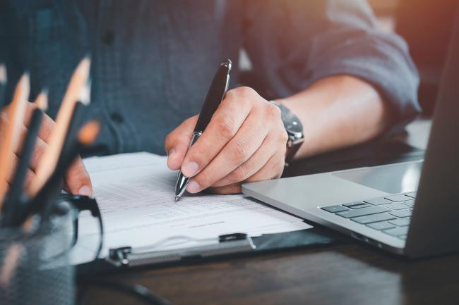 pen writing on paper