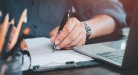 pen writing on paper